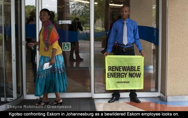 Kgotso confronting Eskom in Johannesburg as a bewildered Eskom employee looks on.
